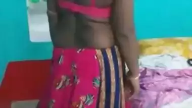 Hot like hell Desi female in sexy pink dress poses for the camera