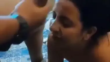 A girl gets cum on her face in an Indian threesome blue film