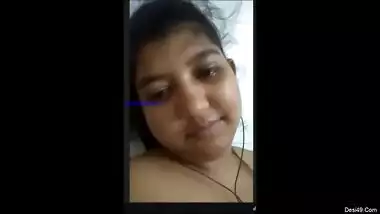 Cheeky Indian girl sticks her tongue out besides showing tits