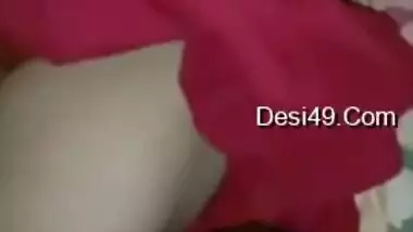 Wife lies on the bed letting the Desi hubby film the porn video